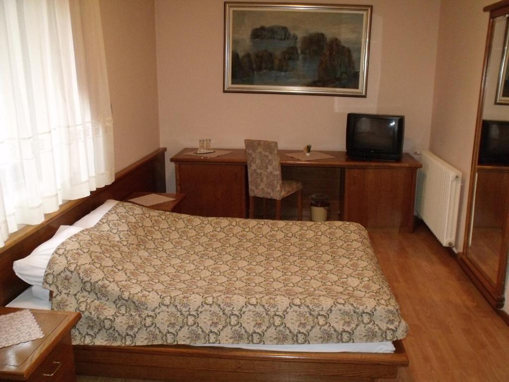 Postel nebo postele na pokoji v ubytování Garni Hotel PBG