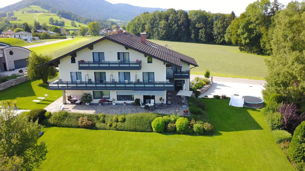 an aerial view of a house on a green lawn at Pension Strobl in Mondsee