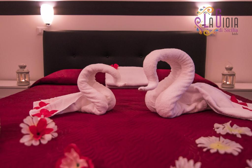 Postel nebo postele na pokoji v ubytování La Gioia di Sicilia B&B