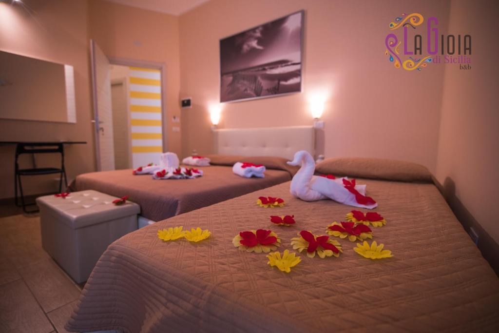Postel nebo postele na pokoji v ubytování La Gioia di Sicilia B&B