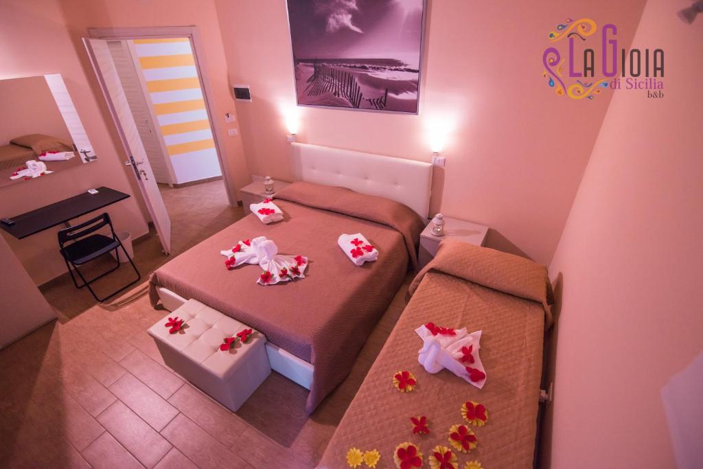 Postel nebo postele na pokoji v ubytování La Gioia di Sicilia B&B