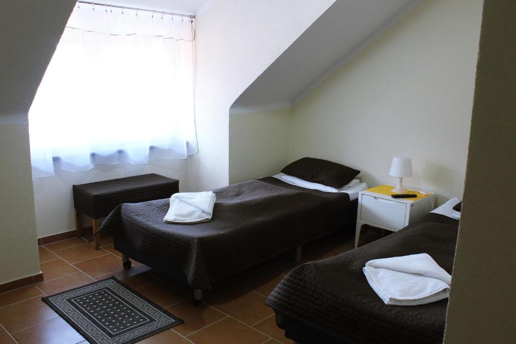 Postel nebo postele na pokoji v ubytování Złoty Potok Resort