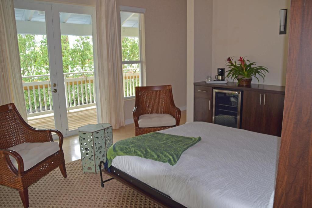 Postel nebo postele na pokoji v ubytování Dolphin Point Villas