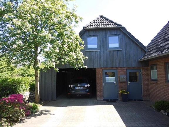 a car is parked inside of a garage at Haus Droste in Husum