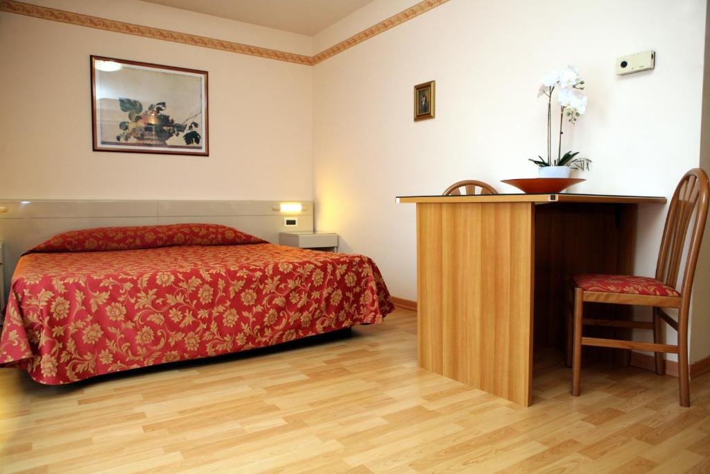 Posteľ alebo postele v izbe v ubytovaní Hotel Excelsior