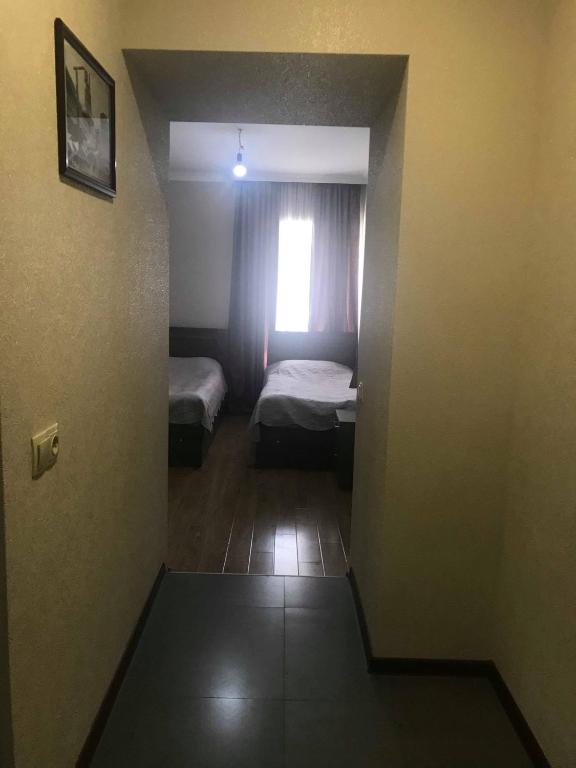 Postel nebo postele na pokoji v ubytování Guesthouse Ori Beli in Mestia