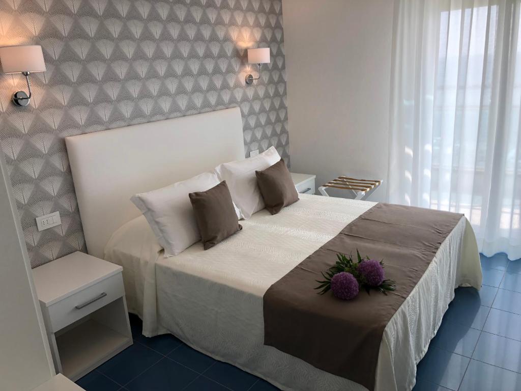 Postel nebo postele na pokoji v ubytování Hotel Gorini