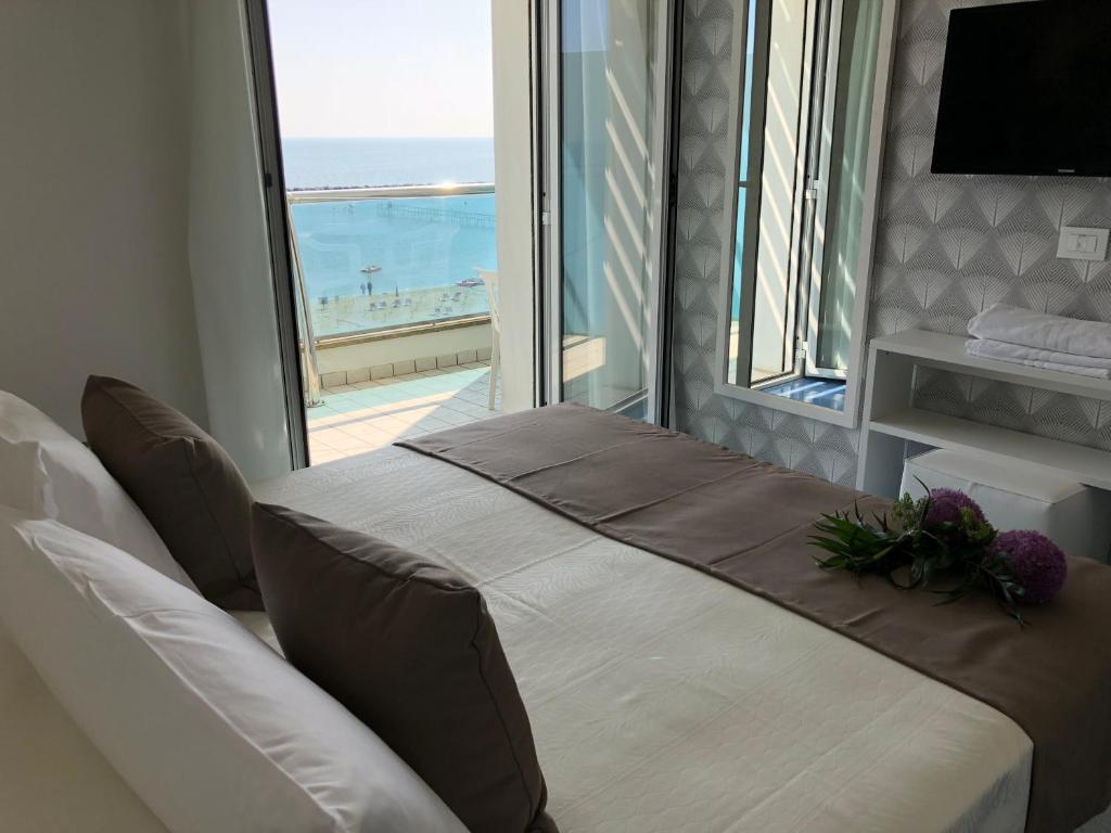 Postel nebo postele na pokoji v ubytování Hotel Gorini