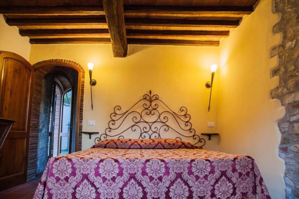 Łóżko lub łóżka w pokoju w obiekcie Agriturismo Borgo Il Bonagino