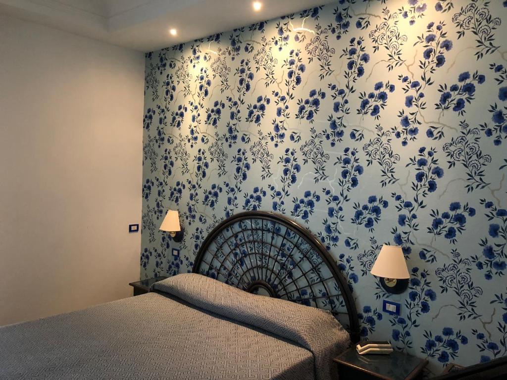 Postel nebo postele na pokoji v ubytování Hotel Gorini