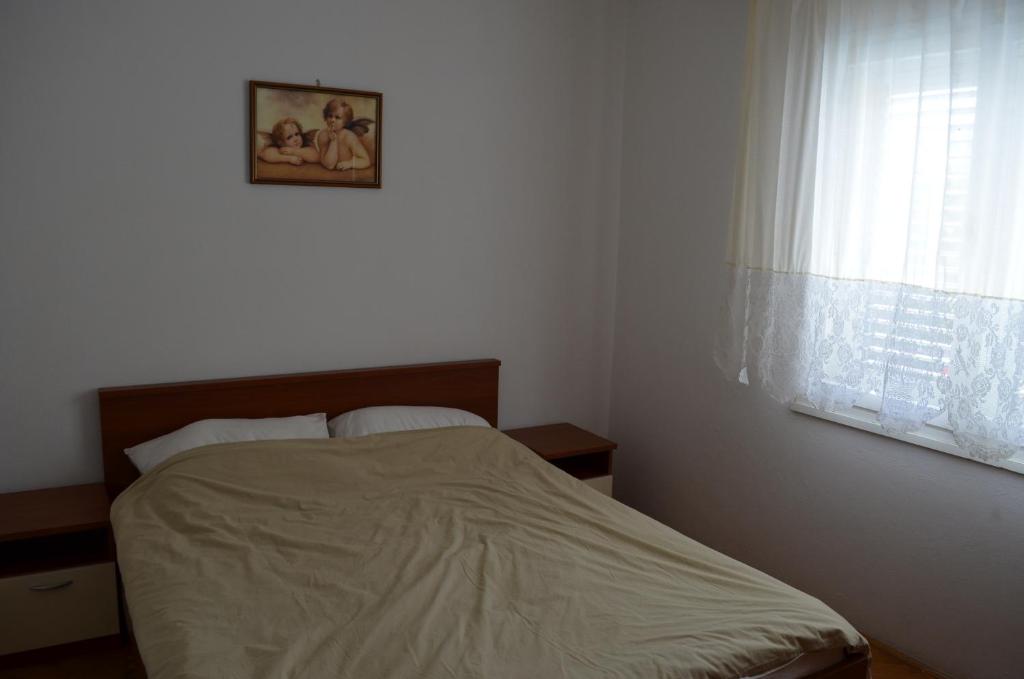 Postel nebo postele na pokoji v ubytování Apartments Antonio