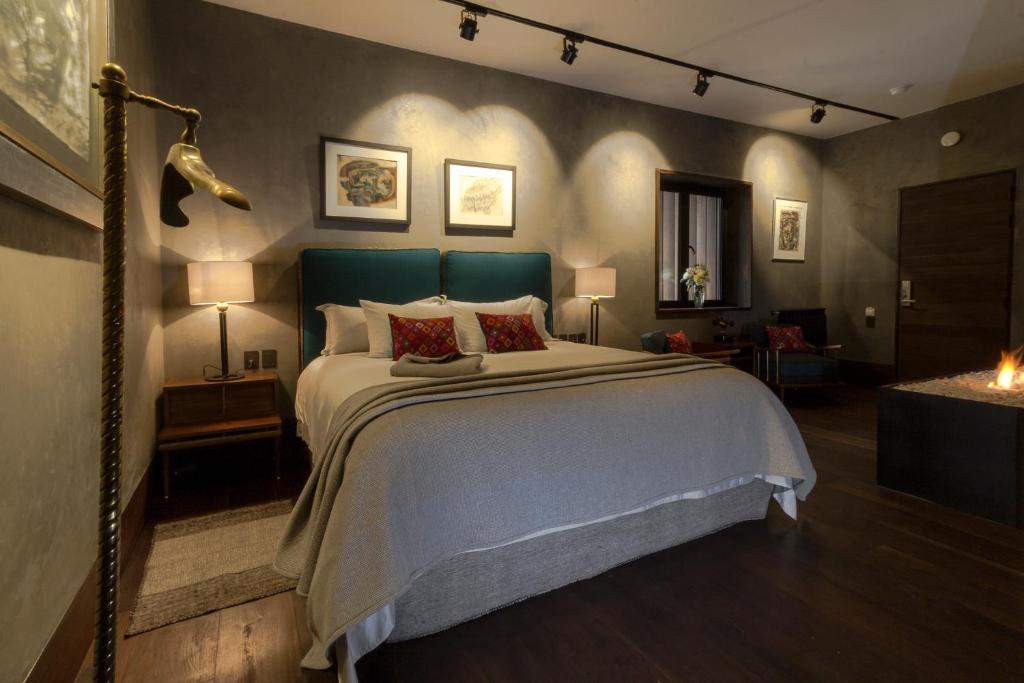 Postel nebo postele na pokoji v ubytování Uvence Arte + Hotel