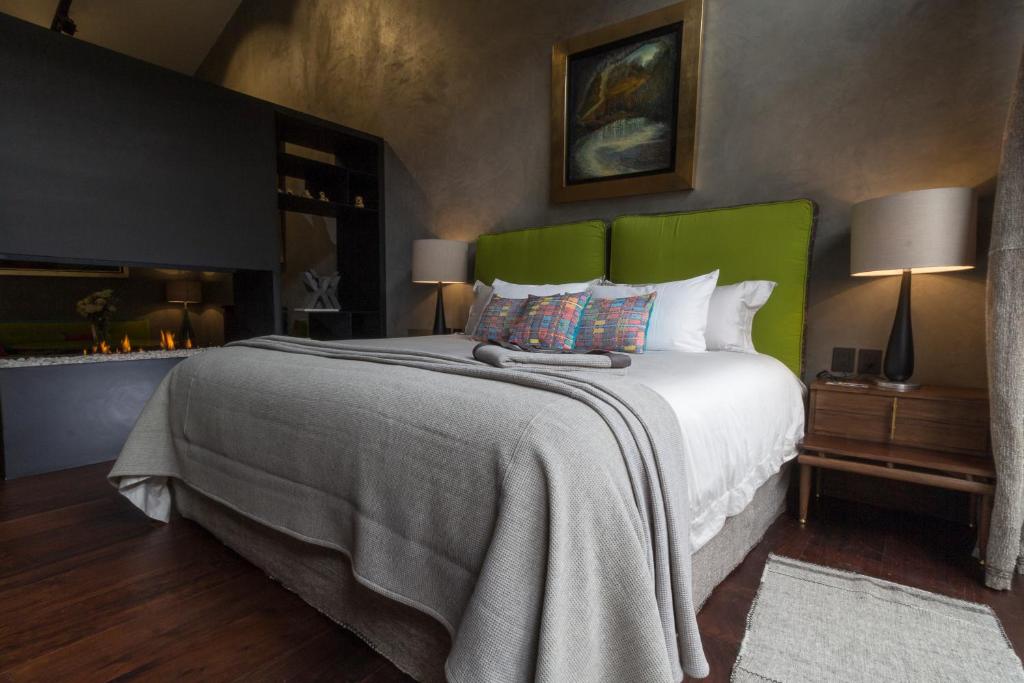 Postel nebo postele na pokoji v ubytování Uvence Arte + Hotel