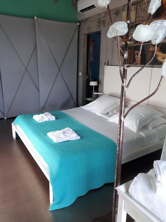 Postel nebo postele na pokoji v ubytování Villa Lodge 4 Epices
