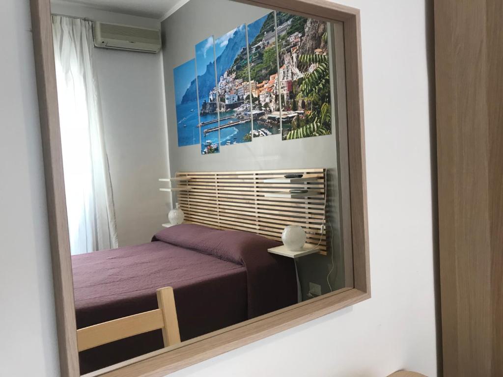 Łóżko lub łóżka w pokoju w obiekcie B&B Salerno Center