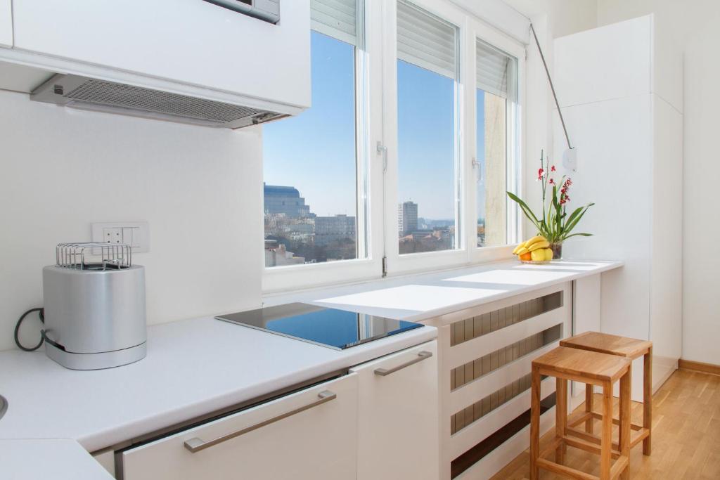 A kitchen or kitchenette at Apartment Slavia District