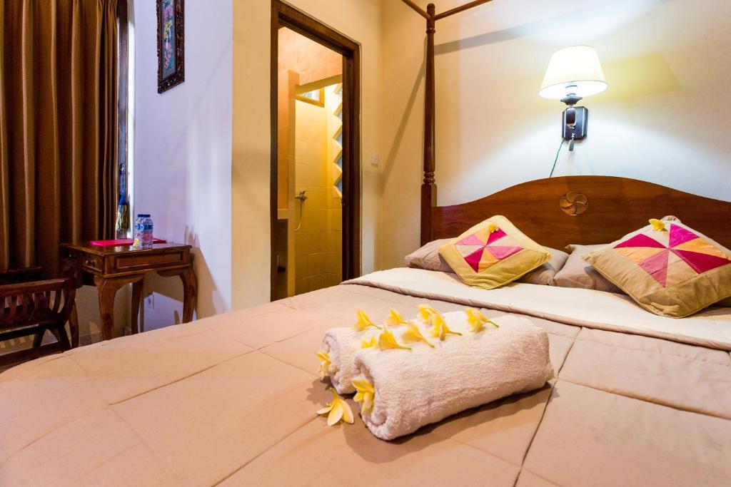Postel nebo postele na pokoji v ubytování Bali Asli Lodge by EPS