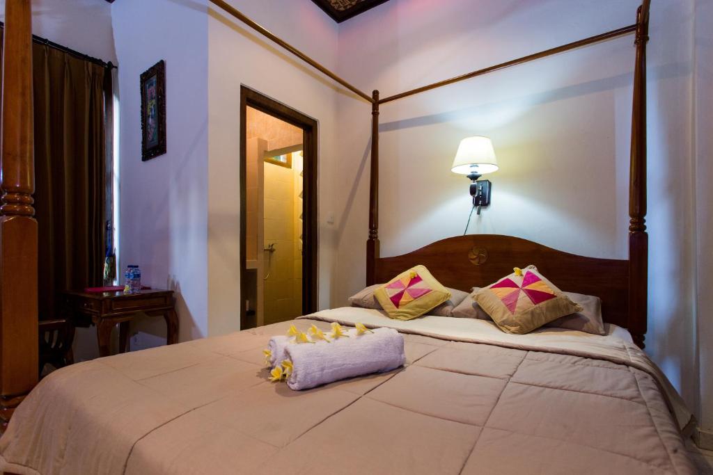 Postel nebo postele na pokoji v ubytování Bali Asli Lodge by EPS
