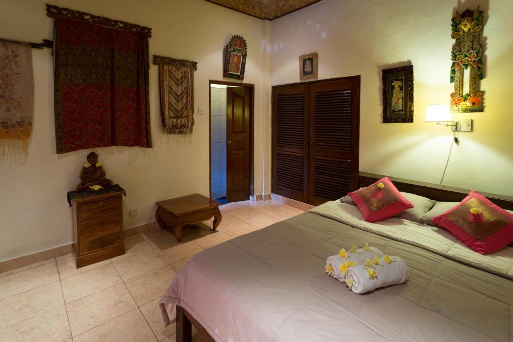 Postel nebo postele na pokoji v ubytování Bali Asli Lodge by EPS