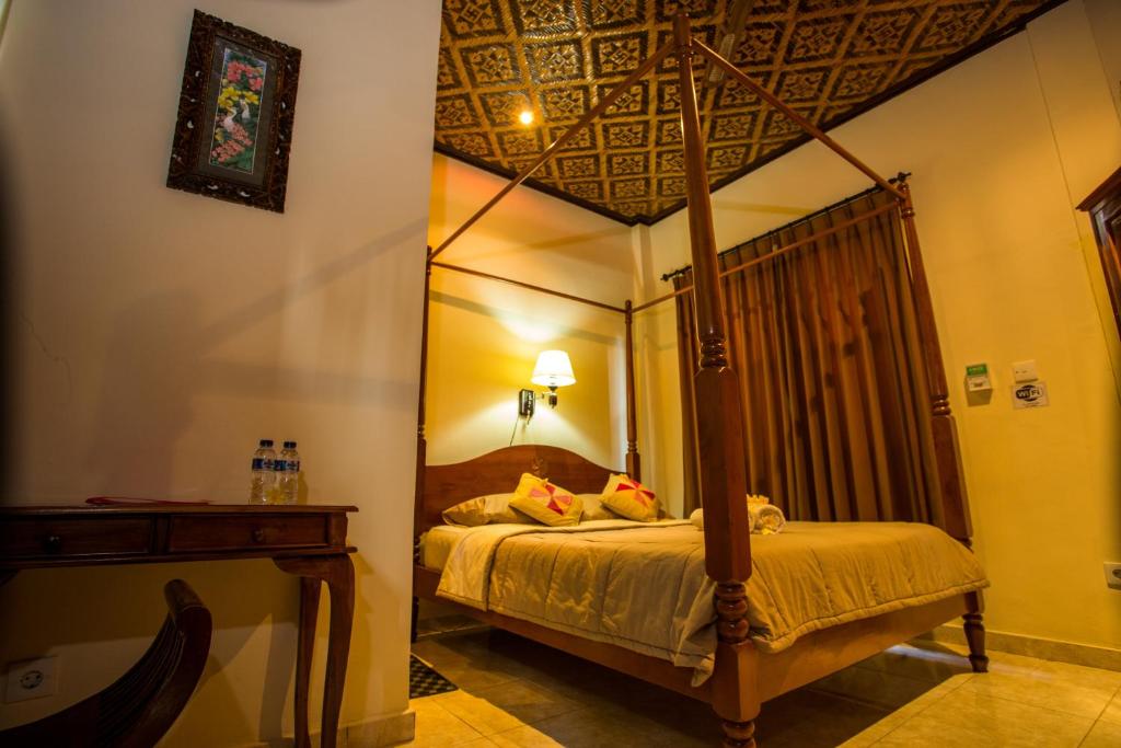 Postel nebo postele na pokoji v ubytování Bali Asli Lodge by EPS