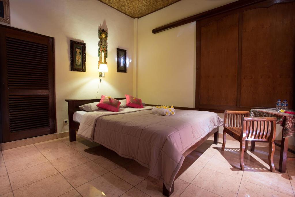 Postel nebo postele na pokoji v ubytování Bali Asli Lodge by EPS