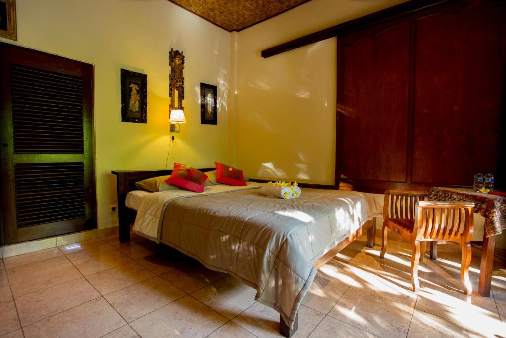 Postel nebo postele na pokoji v ubytování Bali Asli Lodge by EPS