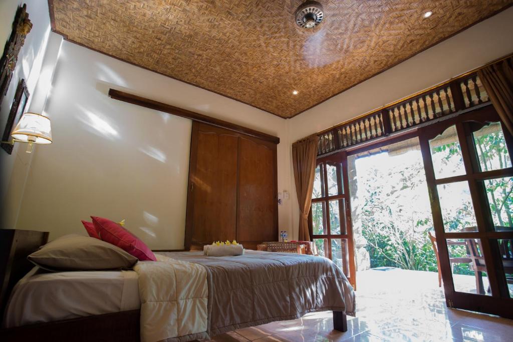 Postel nebo postele na pokoji v ubytování Bali Asli Lodge by EPS