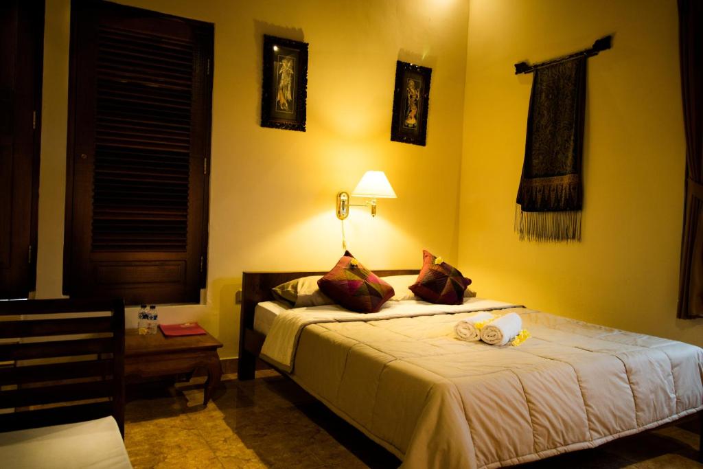 Postel nebo postele na pokoji v ubytování Bali Asli Lodge by EPS