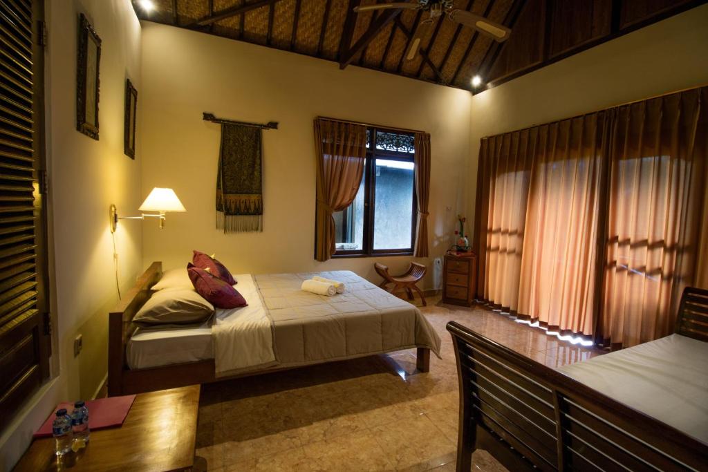 Postel nebo postele na pokoji v ubytování Bali Asli Lodge by EPS