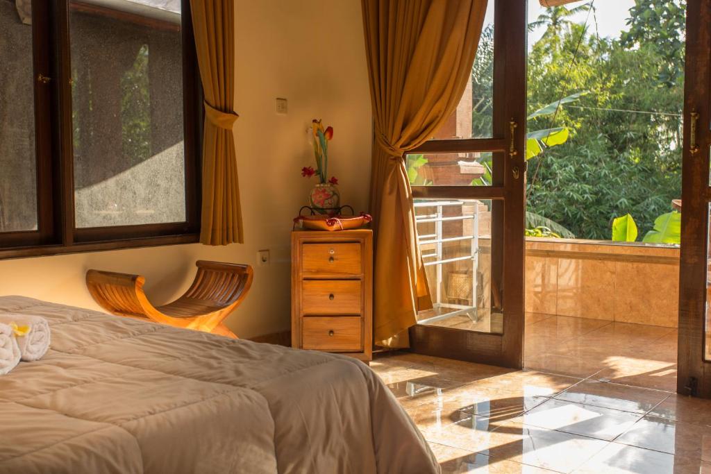 Postel nebo postele na pokoji v ubytování Bali Asli Lodge by EPS