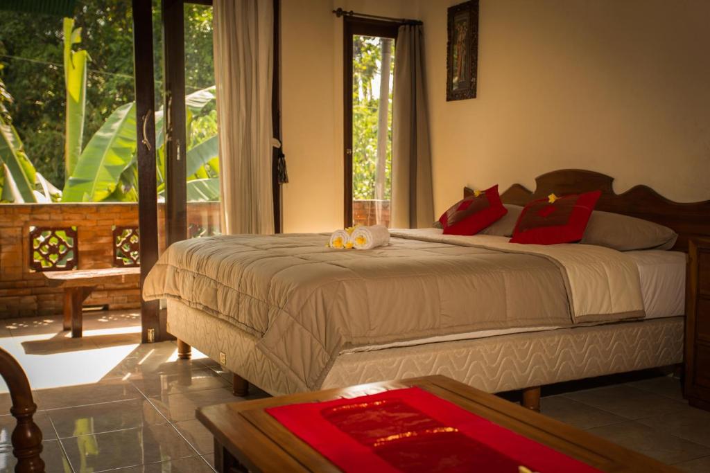 Postel nebo postele na pokoji v ubytování Bali Asli Lodge by EPS
