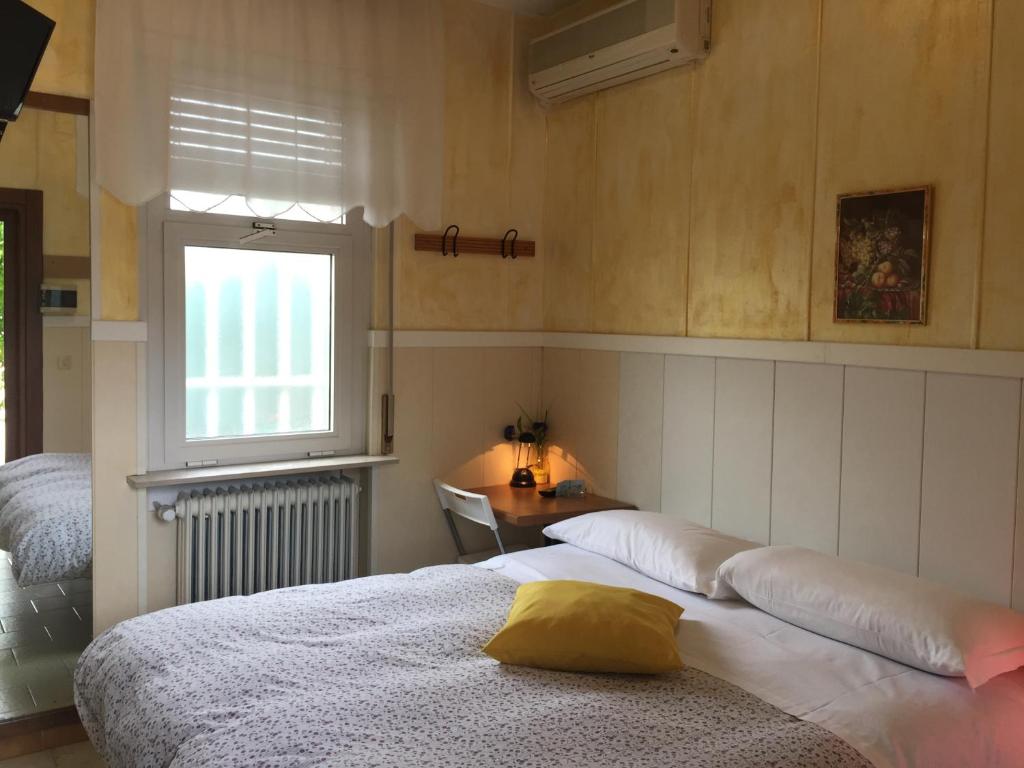 Postel nebo postele na pokoji v ubytování Hotel Moderno