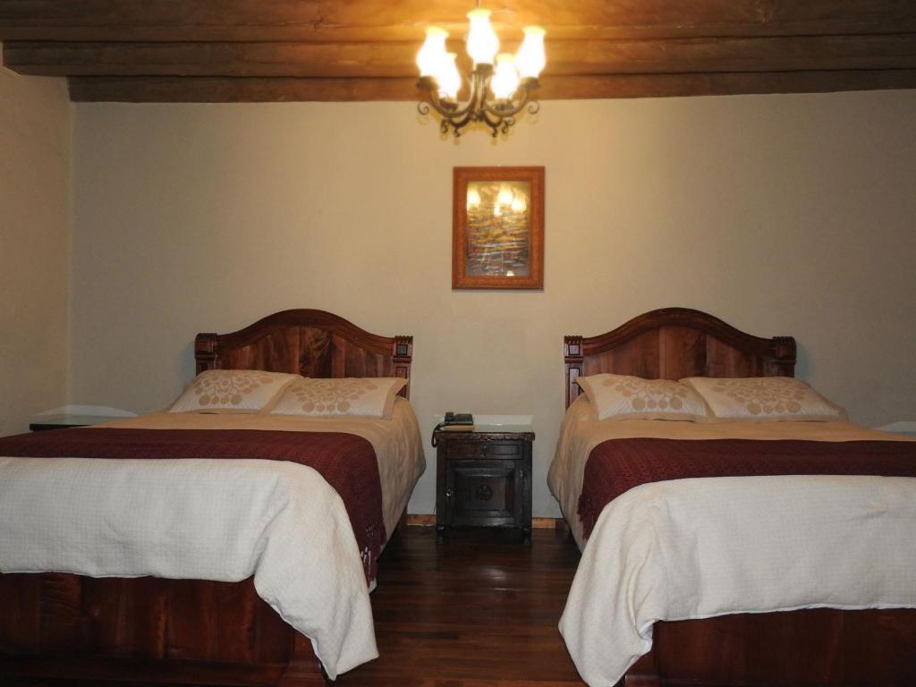 Postel nebo postele na pokoji v ubytování Hotel Santa Clara