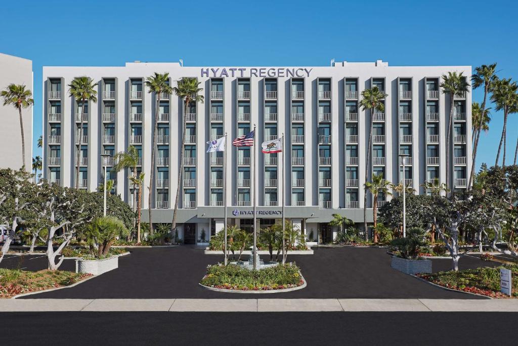 a large building with a large clock on the side of it at Hyatt Regency John Wayne Airport Newport Beach in Newport Beach