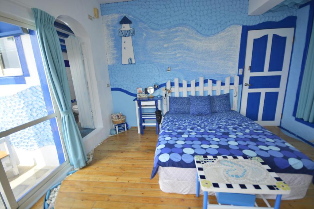 Postel nebo postele na pokoji v ubytování Sea House