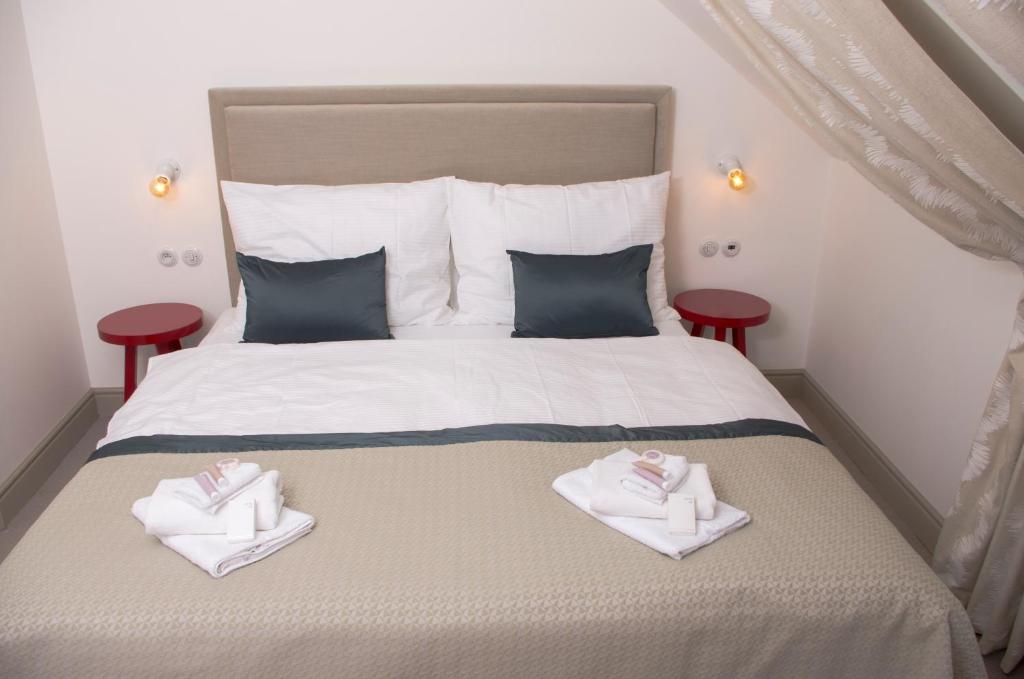Postel nebo postele na pokoji v ubytování Hotel Kocour
