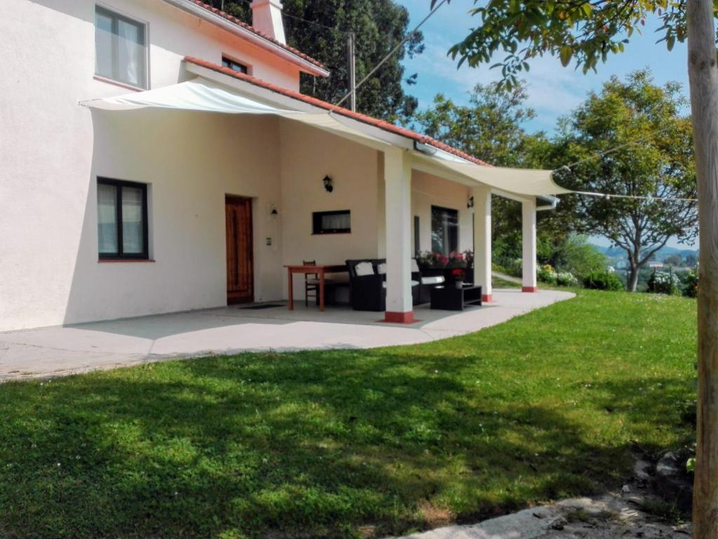 a view of a house with a yard at A Casiña de Mera in Santa Marta de Ortigueira