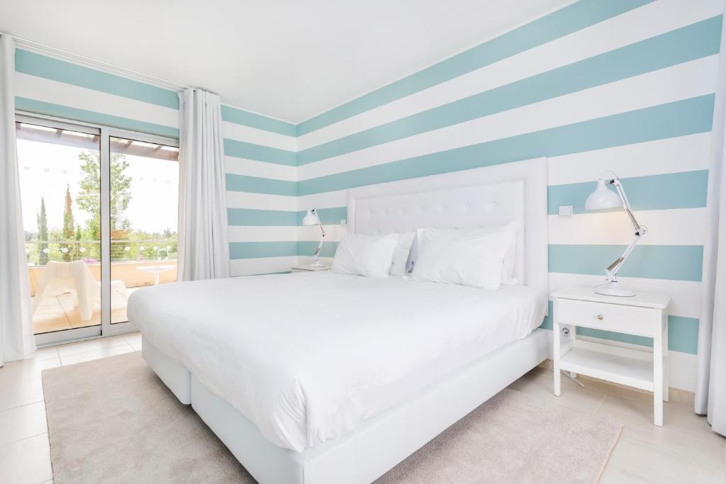 Een bed of bedden in een kamer bij Laguna - Vilamoura
