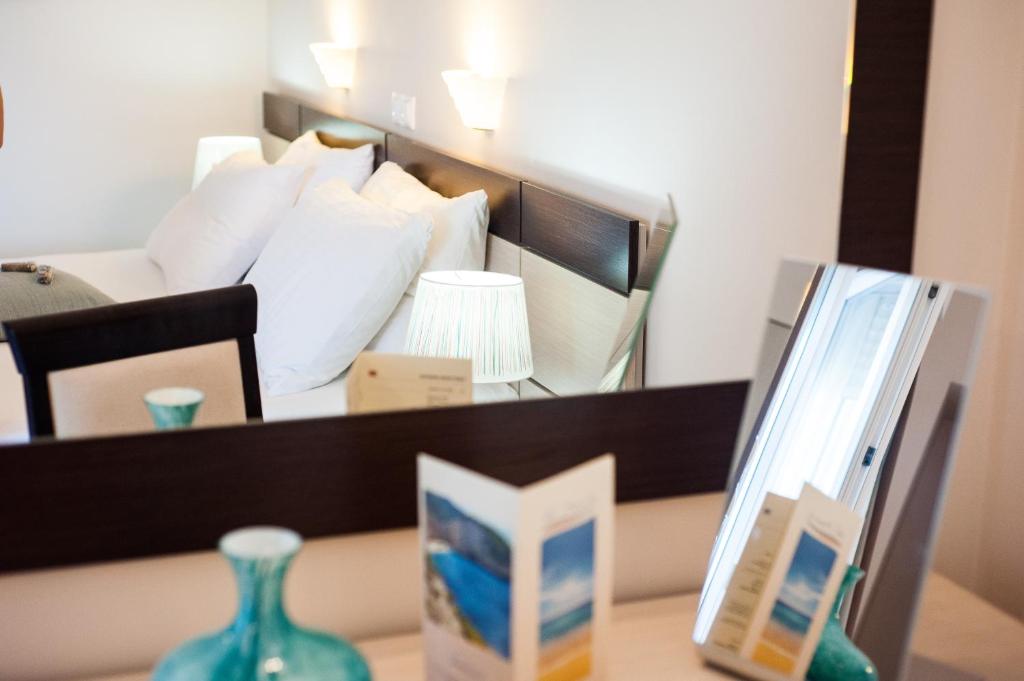 Postel nebo postele na pokoji v ubytování Al Mare Hotel