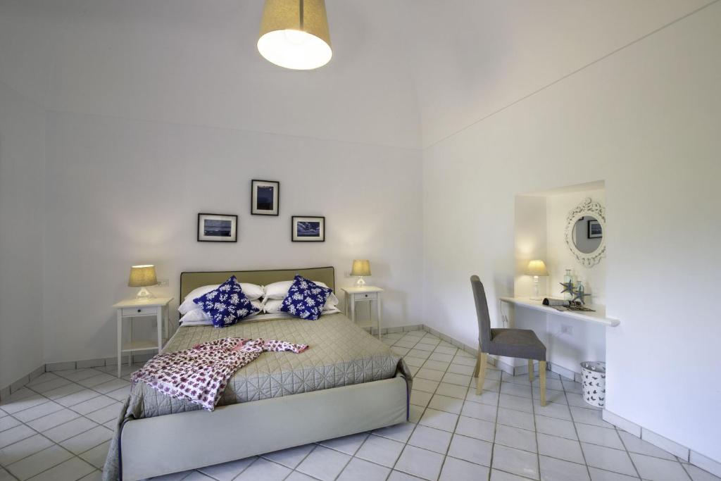 Postel nebo postele na pokoji v ubytování Casa Assunta B&B