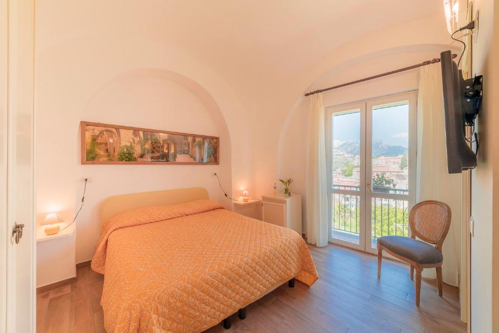 Postel nebo postele na pokoji v ubytování Mimì B&B