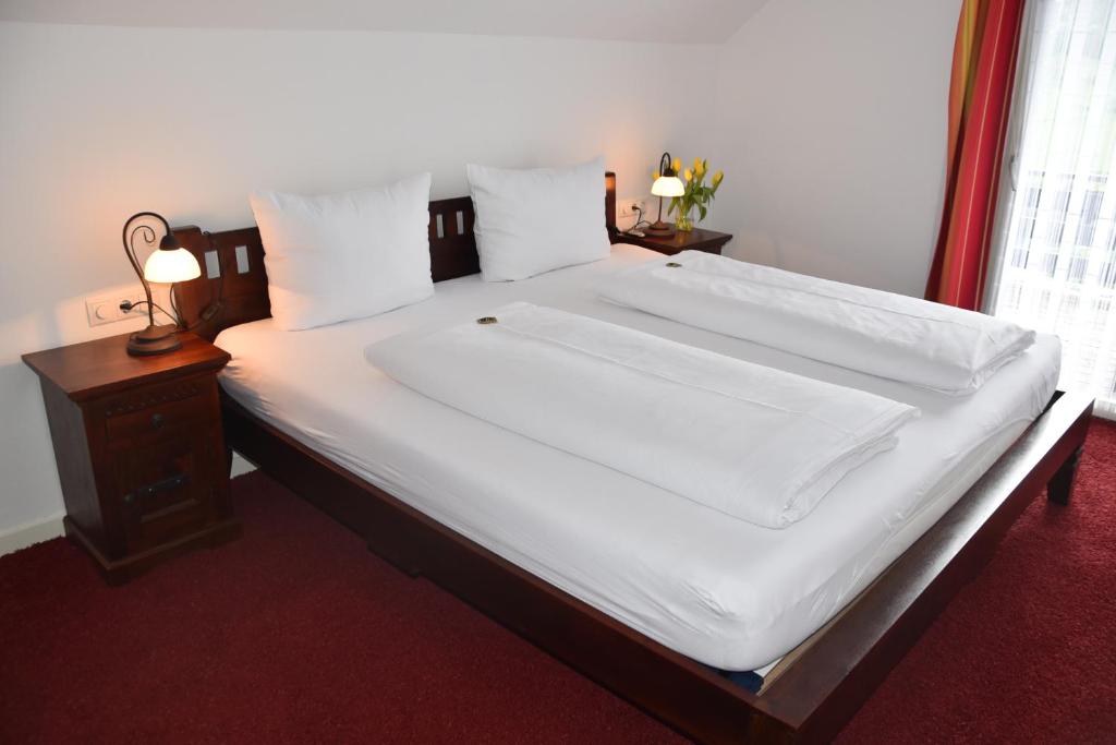 Postel nebo postele na pokoji v ubytování Hotel & Chalets Herrihof