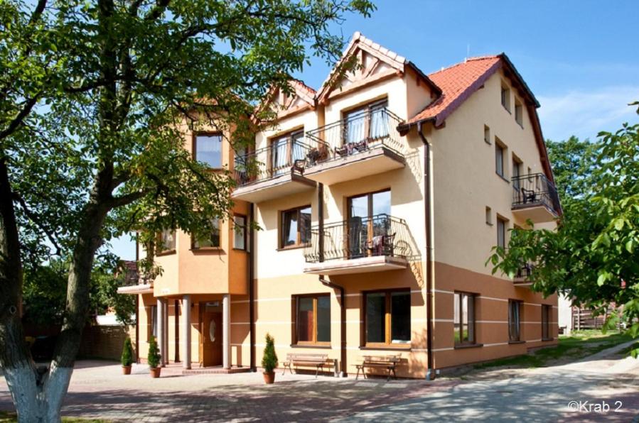 a large building with balconies on the side of it at KRAB 2 in Rewal