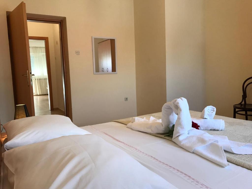 Postel nebo postele na pokoji v ubytování Apartments A&A