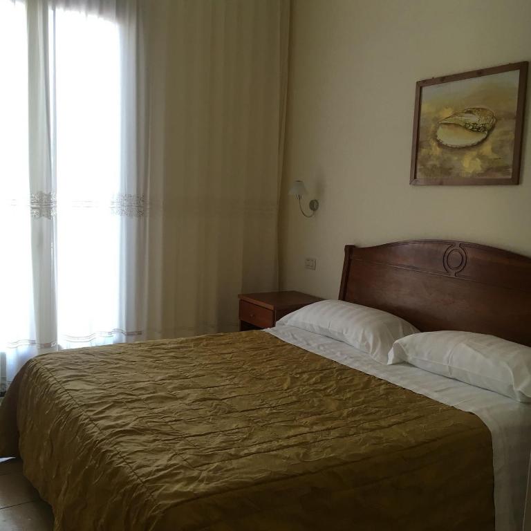 Postel nebo postele na pokoji v ubytování La Conchiglia