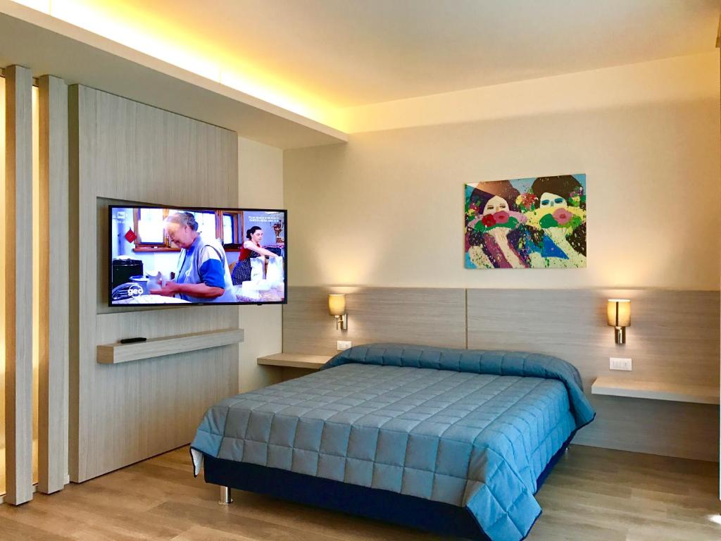 TV a/nebo společenská místnost v ubytování Hotel Ancora