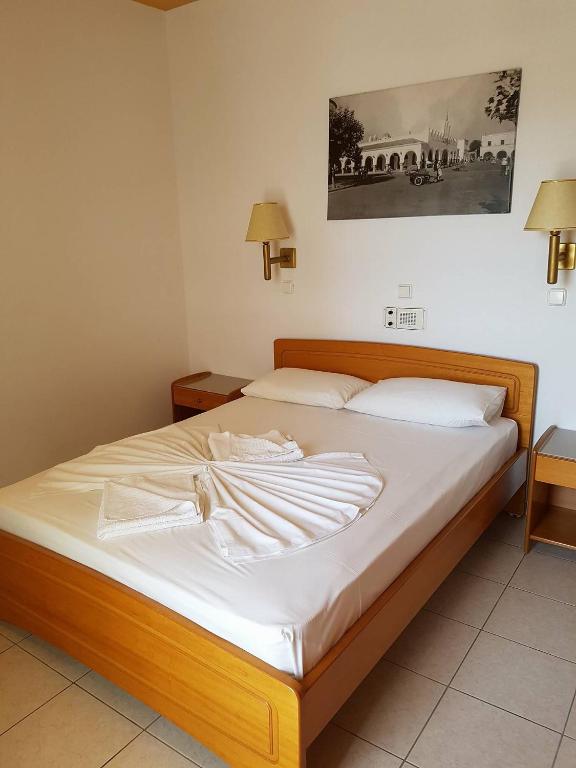 Postel nebo postele na pokoji v ubytování Agrellis Apartments