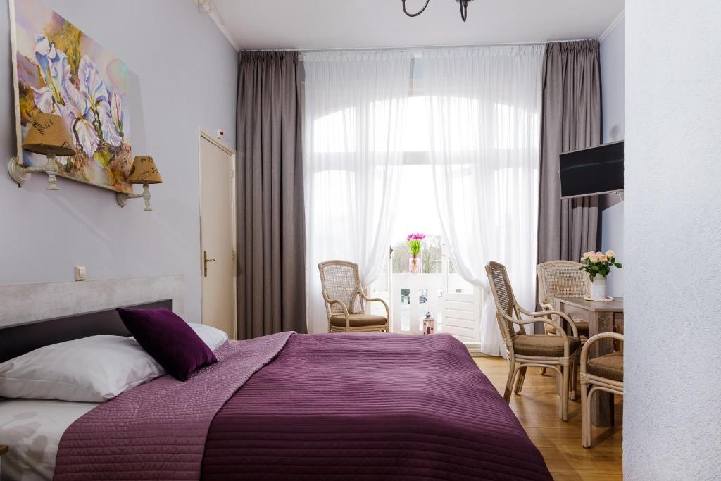 Postel nebo postele na pokoji v ubytování Hotel Corel