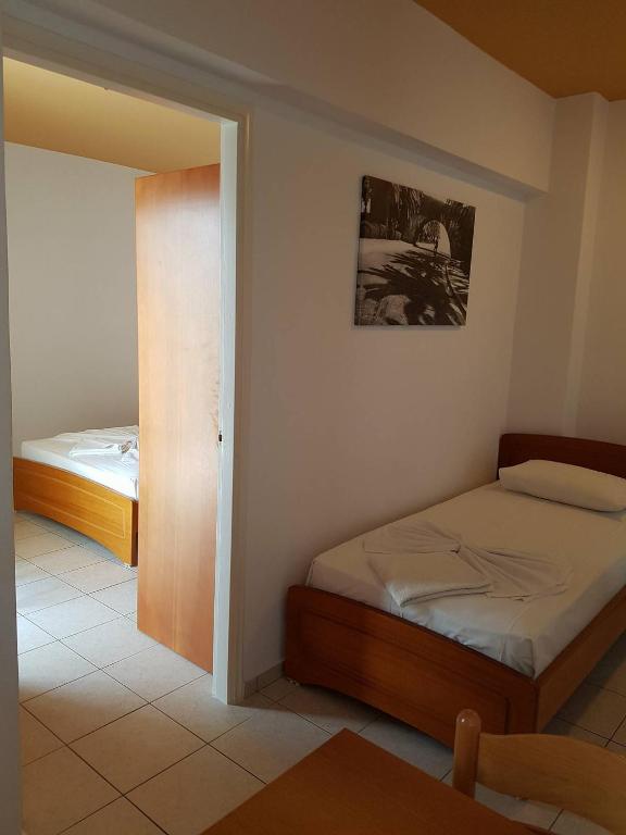 Postel nebo postele na pokoji v ubytování Agrellis Apartments