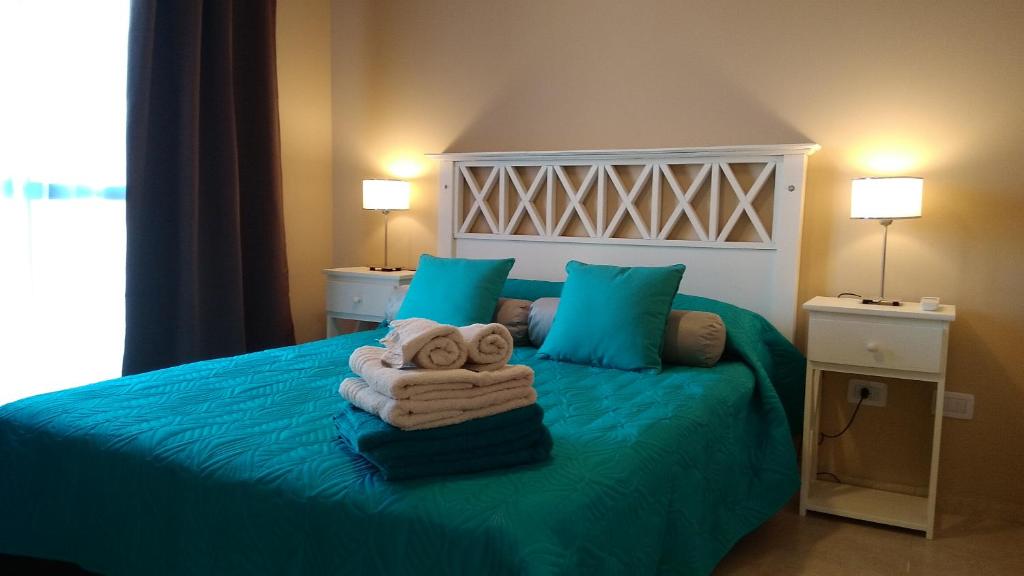 Ένα ή περισσότερα κρεβάτια σε δωμάτιο στο Merlo Centro Aparts